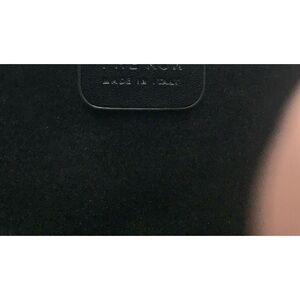 The Row half moon handbag in black.